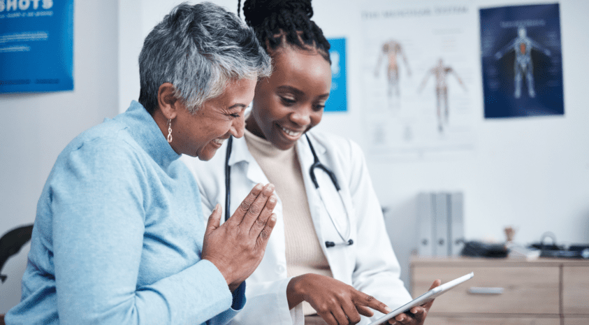 Doctor and patient laughing together