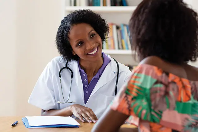 Two women talking - Doctor and patient
