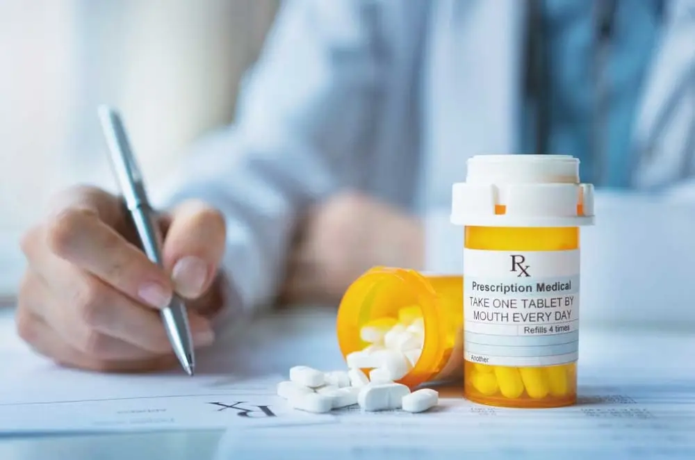 pill bottles - Dr. writing a script